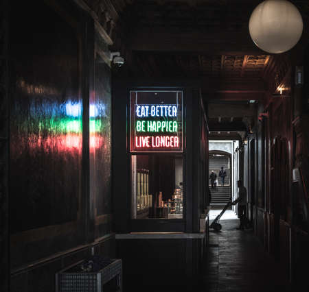 dark passage of the city with a fast food takeawayの写真素材
