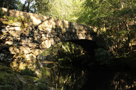 Traditional stone bridge over the river Vilacova in Noiaの写真素材