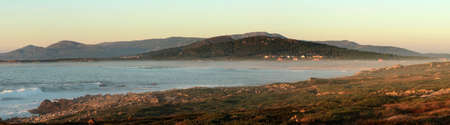 Panoramic view of Balieiros beach at sunset, with Mount Tahume and the Barbanza mountain range in the background, near Corrubedo (CoruÃ±a).の写真素材