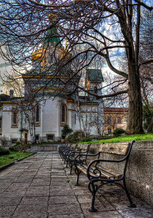 Saint Nikolay Chudotvorets church in Sofia, Bulgaria. Benches in line.