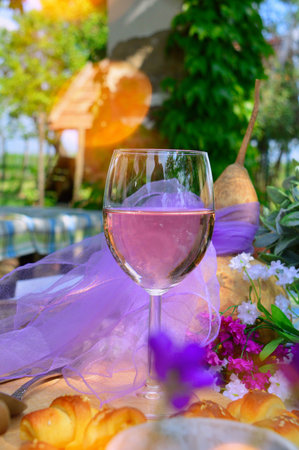 wine glass filled with rosemary still life