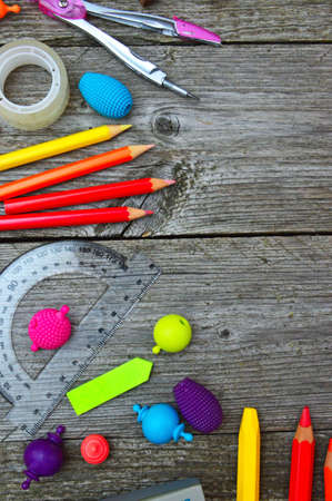 Stationary, crayons and color pencils on wooden tableの写真素材