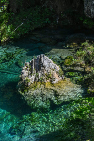 crystal clear blue water of a mountain lake