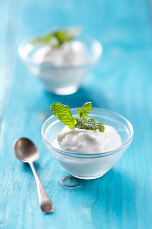 greek yogurt on blu tableの写真素材