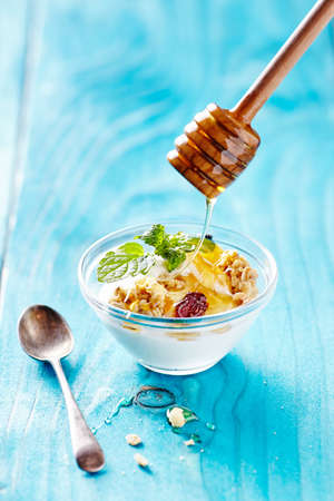 greek yogurt on blu tableの写真素材