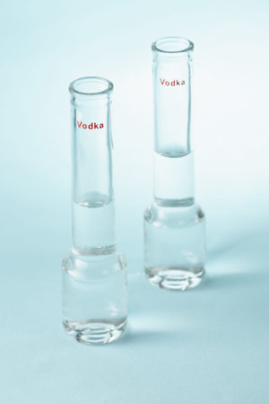 Vodka glass on a blue backgroundの写真素材