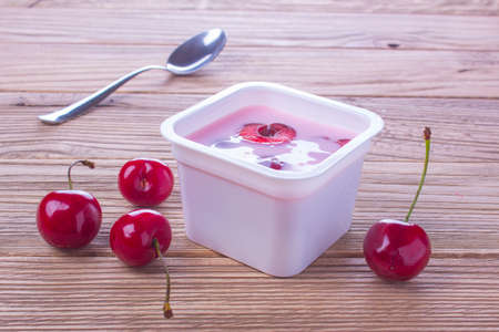 yogurt with fresh red berriesの写真素材
