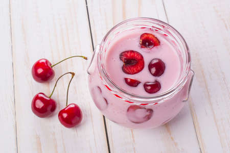 yogurt with fresh red berriesの写真素材