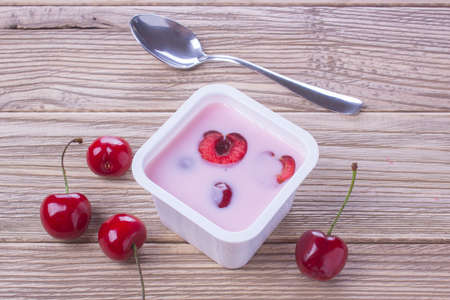 yogurt with fresh red berriesの写真素材
