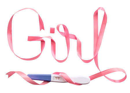 Word girl written gift ribbon pink. A positive pregnancy test. White background, isolatedの写真素材