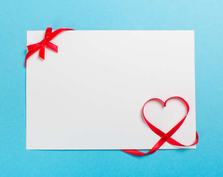 Blank letter with ribbon in the shape of a heart. Love Valentines Dayの写真素材