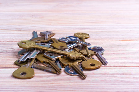 Older different keys on a old wooden table