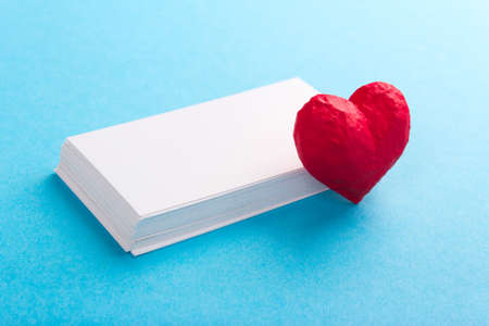 Red heart and white blank card. Love Valentines Day. Blue backgroundの写真素材