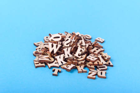 Wooden letters of the English alphabet on a blue backgroundの写真素材