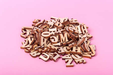Wooden letters of the English alphabet on a pink backgroundの写真素材