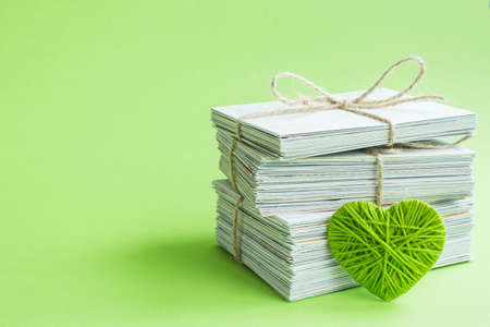 Blank white post cards, empty postcard, postcrossing, green heart love letterの写真素材
