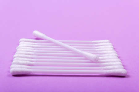 closeup clean ear sticks on violet background slideの写真素材