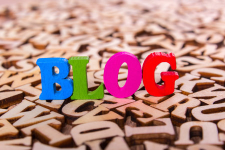 Blog word made from colored wooden letters on an old table. Conceptの写真素材