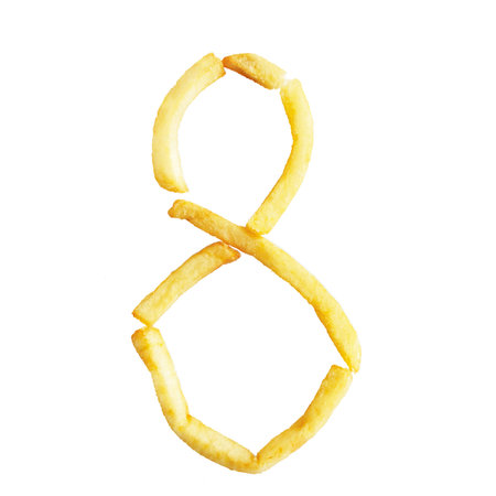 Number eight 8 symbol is made of the same fries. Alphabet of French fries. Isolate on whiteの写真素材