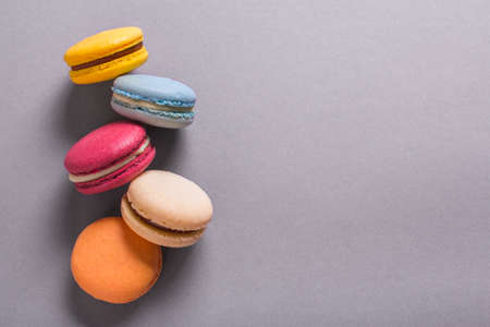 Cake macaron or macaroon colorful cookies. On a gray background. Empty space for textの写真素材