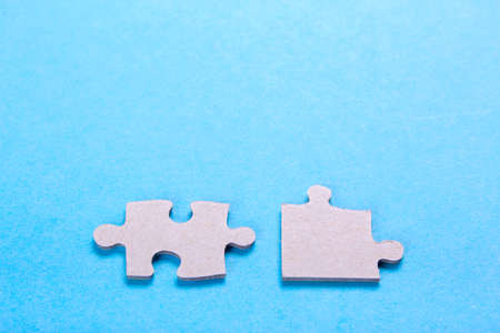 Puzzle pieces with empty space for text on a blue backgroundの写真素材