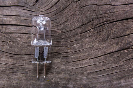 incandescent bulbs on an old wooden table, close-upの写真素材