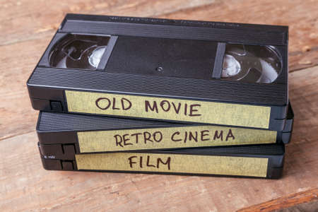 Cassettes VHS with old films on wooden boardsの写真素材