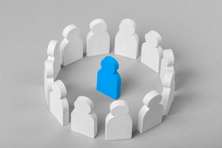 Concept leader of  business team. Crowd of white men stands in  circle and listens to the leader of the blue colorの写真素材