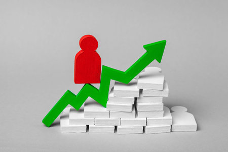 Work of the team on dew nailed in the business, the productive work of the leader. The bustling growth is due to the command. Group of people with a leader and green arrow up. Conceptの写真素材