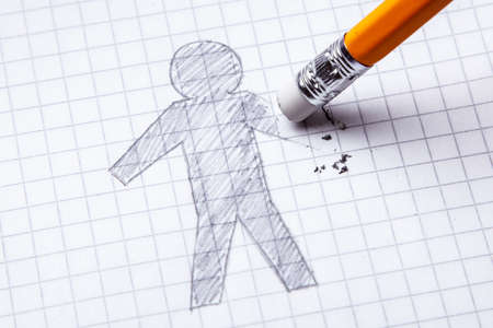 Concept. Loss of hands, amputation. Drawing with pencil of man with an erased hand.の写真素材