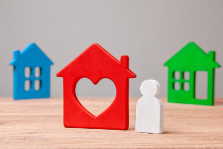 Choose a house to buy or rent. Little man and colorful houses.