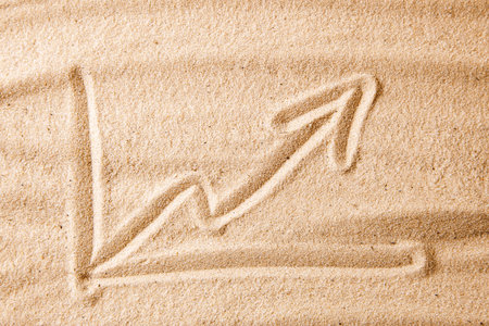 Beach and arrow chart up in the sand. The concept of sales growth, growth in prices in the turistic...