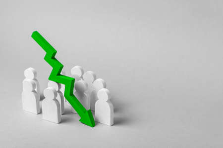 Bad team work, failure in business. The fall in profits and growth indicators. Group of workers and  pointing down arrow. Conceptの写真素材