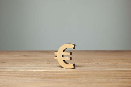 Euro symbol of wood on wooden tableの写真素材