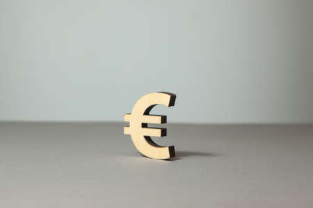 Euro symbol from wood on a gray background.の写真素材