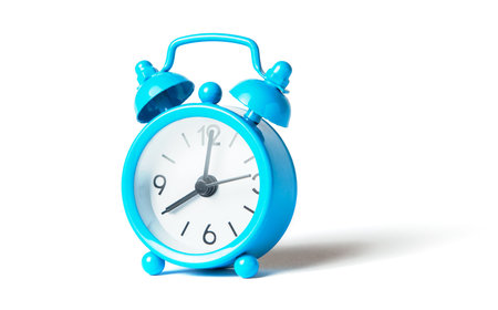 Blue alarm clock isolated on white background.