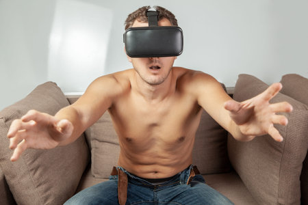 Virtual sex in VR glasses. Man is naked and in VR glasses of virtual reality has sex.