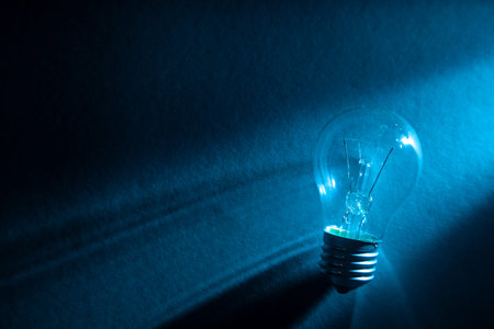 Glass bulb on blue background