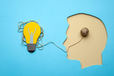 Business idea or problem solving. Head profile of man with a light bulb.