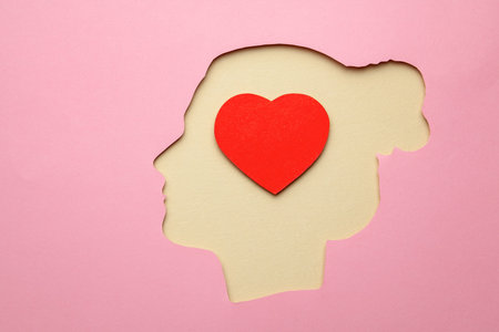 Silhouette of woman and inside the brain in the head heart as symbol of love