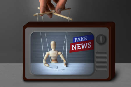 Fake News on TV. The correspondent as the doll controls the puppeteer. Lying information to trick people on TV.の写真素材