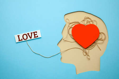 Profile of mans head in which there is heart as symbol of love.の写真素材