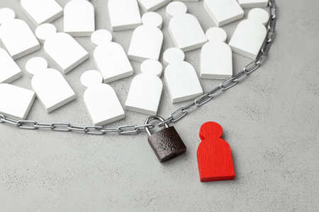 Human rights. Restriction of freedom. Many people are chained and locked. The power of the dictator is controlled by the people.の写真素材