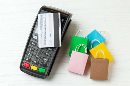 POS terminal, Payment Machine with credit card on white background. Contactless payment with NFC technologyの写真素材