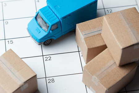Moving day. Calendar for note with cardboard boxes and truck