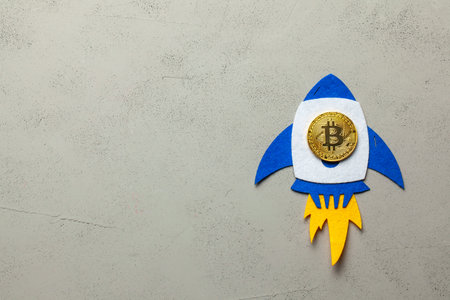 Bitcoin rocket with a cryptocurrency coin flies up.