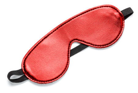 Sleep mask in red leather. Eye patch for sex games. Isolated on white background.の写真素材