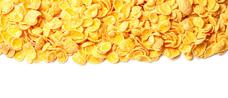Cornflakes dry breakfast. Yellow flakes in bunch on top of frame isolated on white background.
