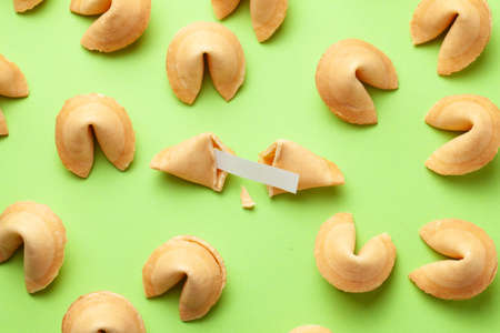 Chinese fortune cookies. Cookies texture pattern with empty blank inside for word prediction. Green backgroundの写真素材