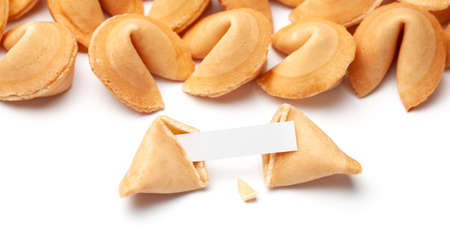 Chinese fortune cookies. Cookies with empty blank inside for prediction words. Isolated on white backgroundの写真素材